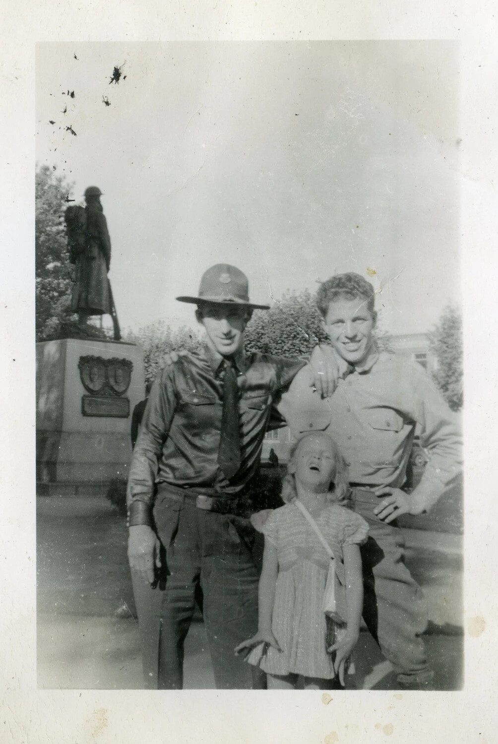 Two Servicemen and a Child at a WWI Memorial Statue, Kwajalein Military Album