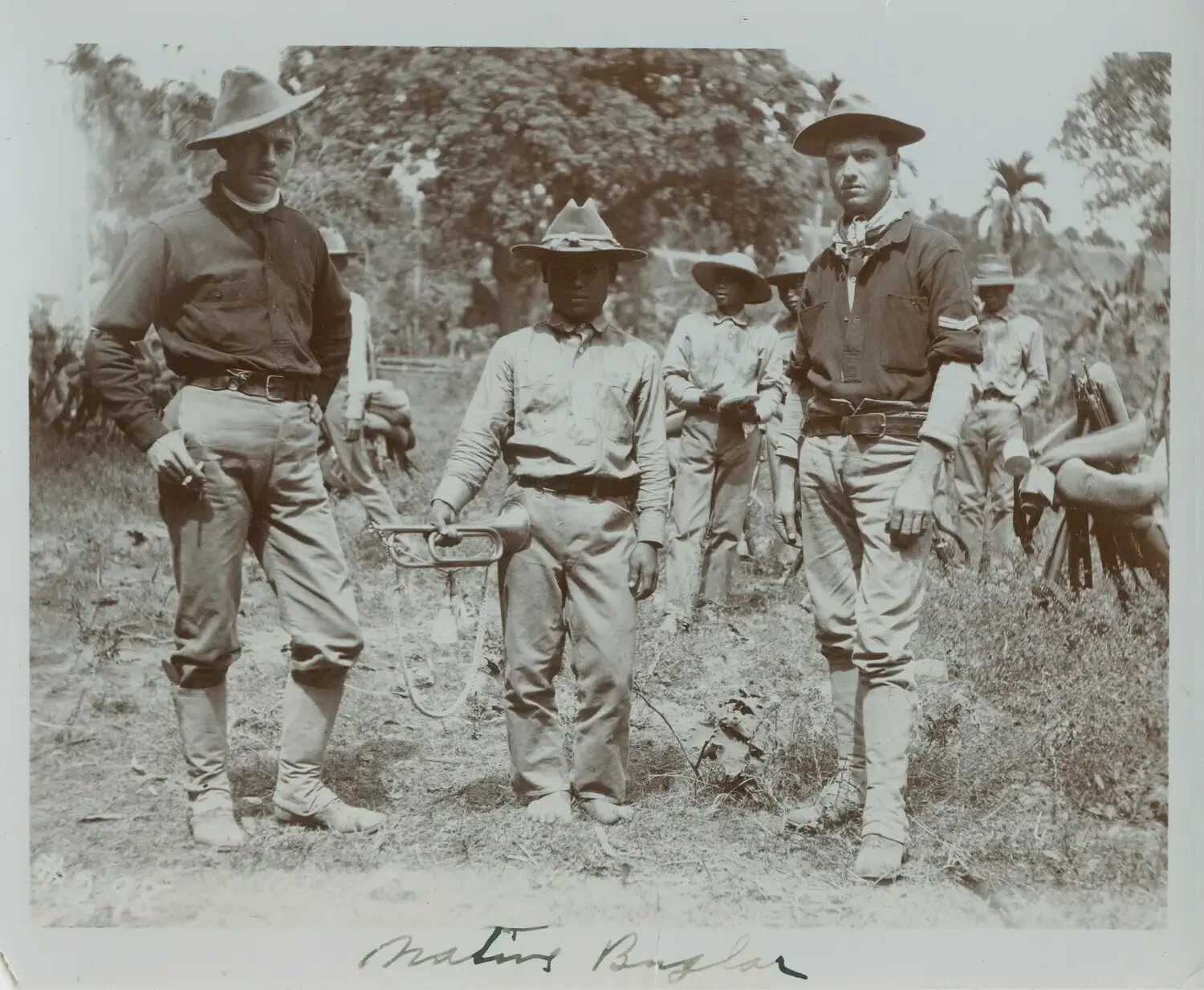 American Soldiers with Native Filipino Bugler, Philippines, c. 1890s -- 'Native Bugler'