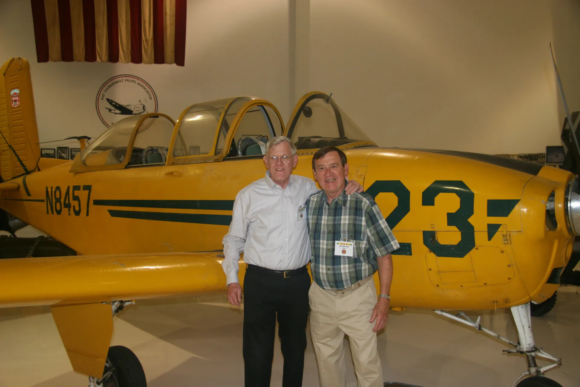 Reunion Attendees with Yellow Trainer Aircraft 'N8457,' Operation Tailwind Reunion Event, 2016