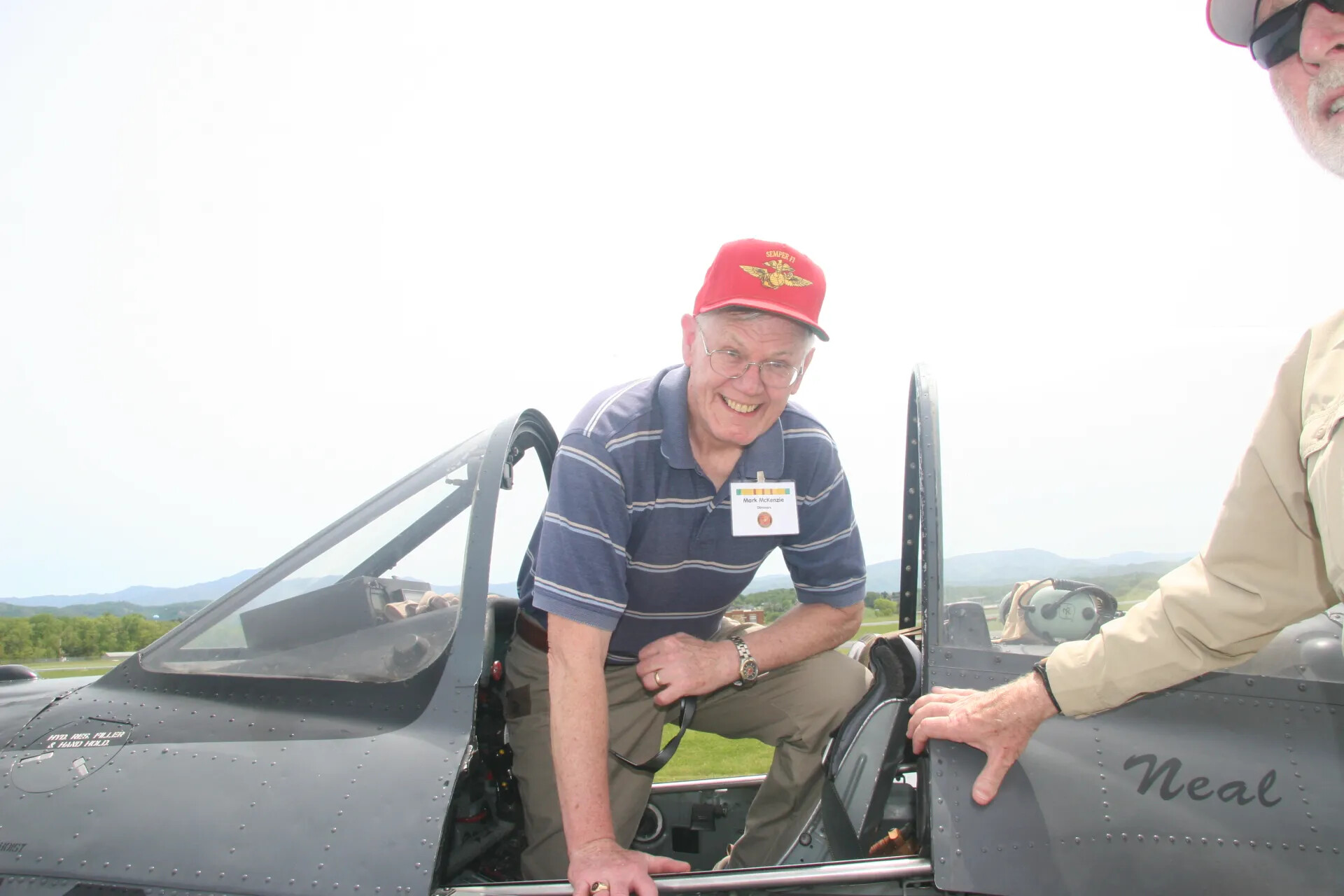 Veteran Mark McKenzie Boarding Vintage Trainer Aircraft 'Neal' — 2016 Operation Tailwind Reunion