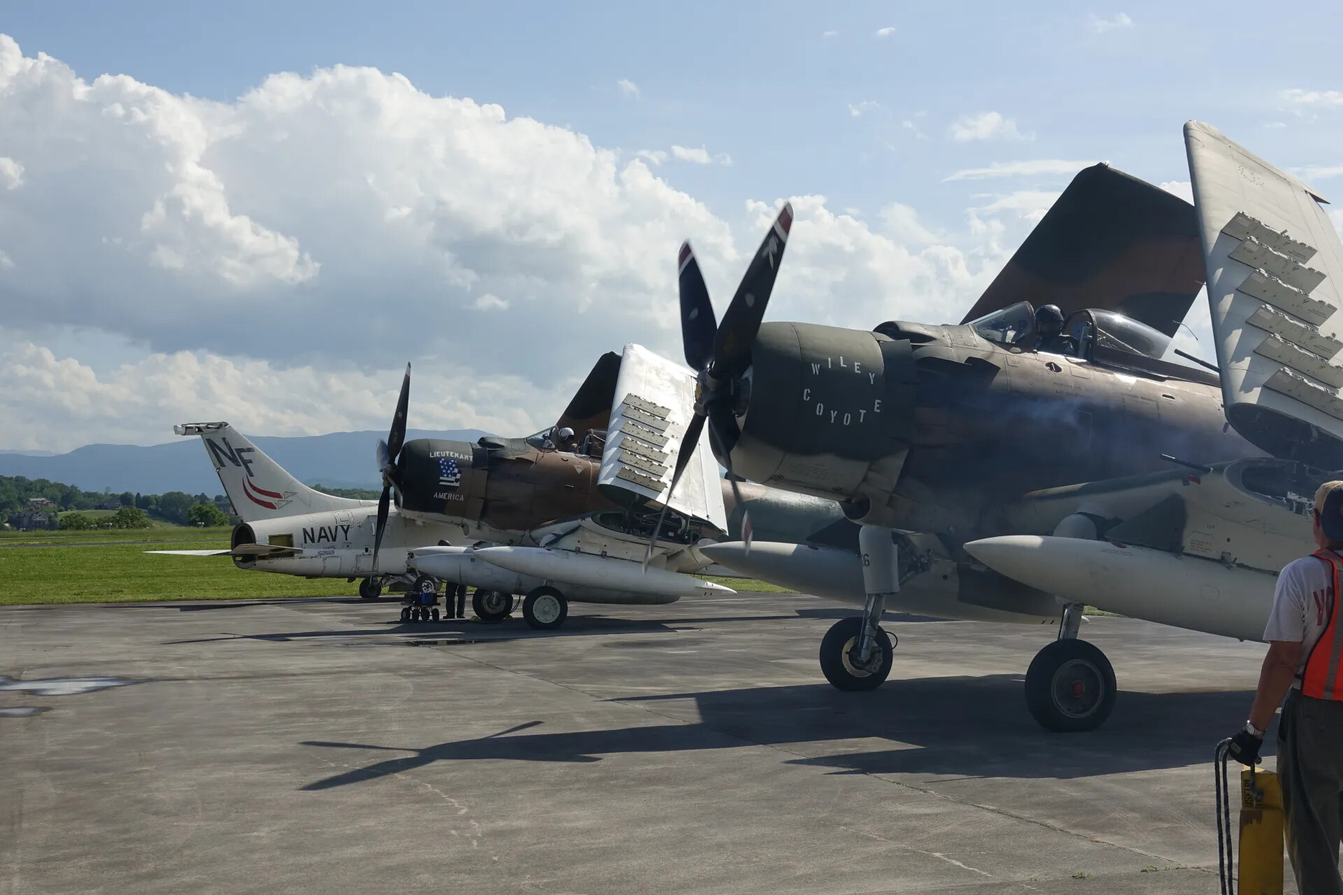 A-1 Skyraiders "Wiley Coyote" and "Lieutenant America" with Navy A-7A Corsair II, Tail Code NF 152669