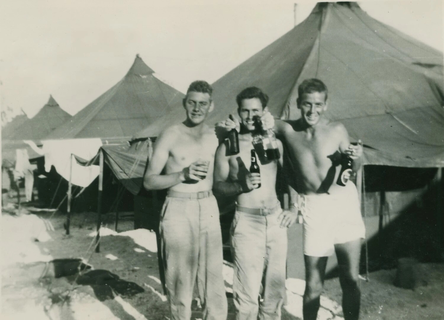 Three Servicemen with Beer Bottles in Tent Camp, McAleer Photo Album