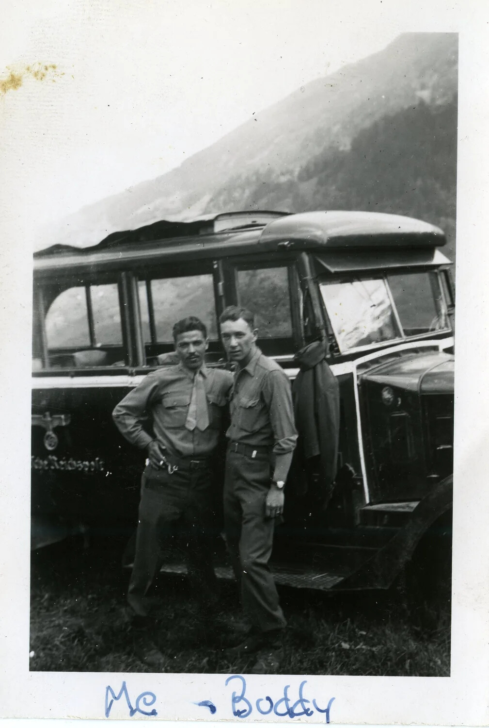 Two GIs of the 44th Infantry Division Posed Before a Captured German Reichspost Bus, Alpine Region, 1945