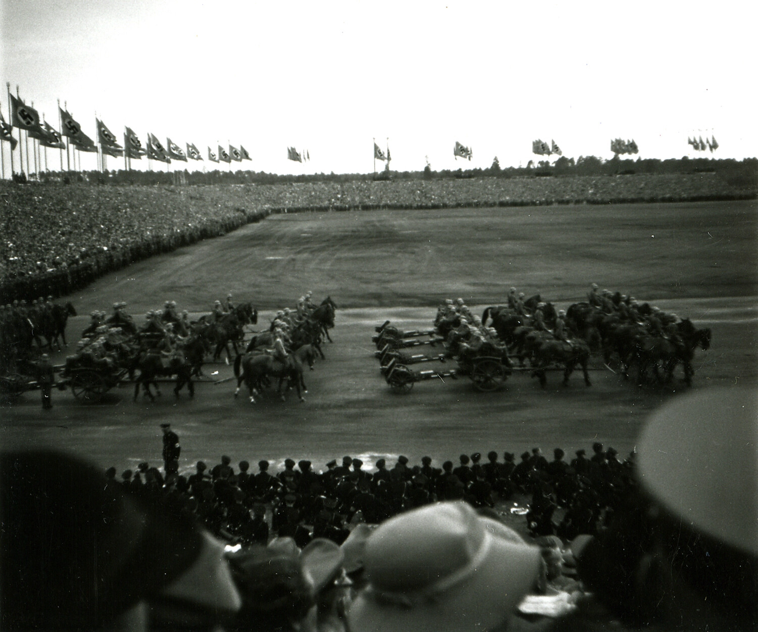 Nazi Party Rally Grounds, Nuremberg, Germany — Horse-Drawn Military Parade with Swastika Flag Line, Pre-WWII Era