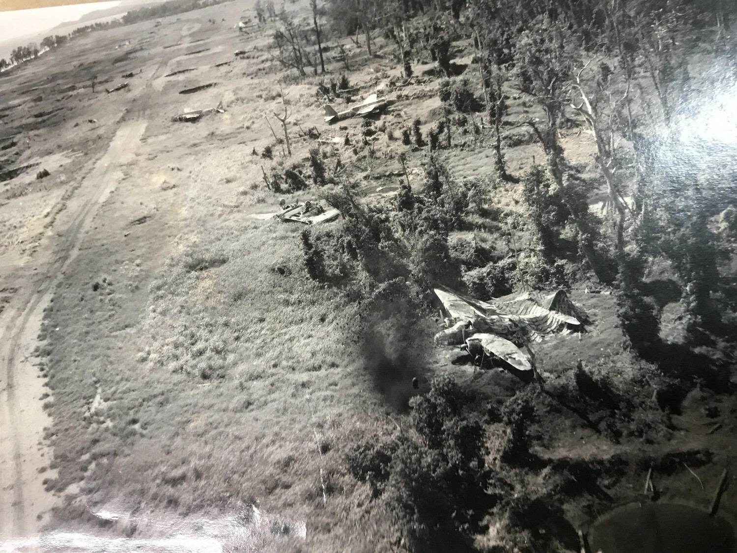 Wrecked Japanese Aircraft in Dispersal Area Following Airfield Strike, New Guinea