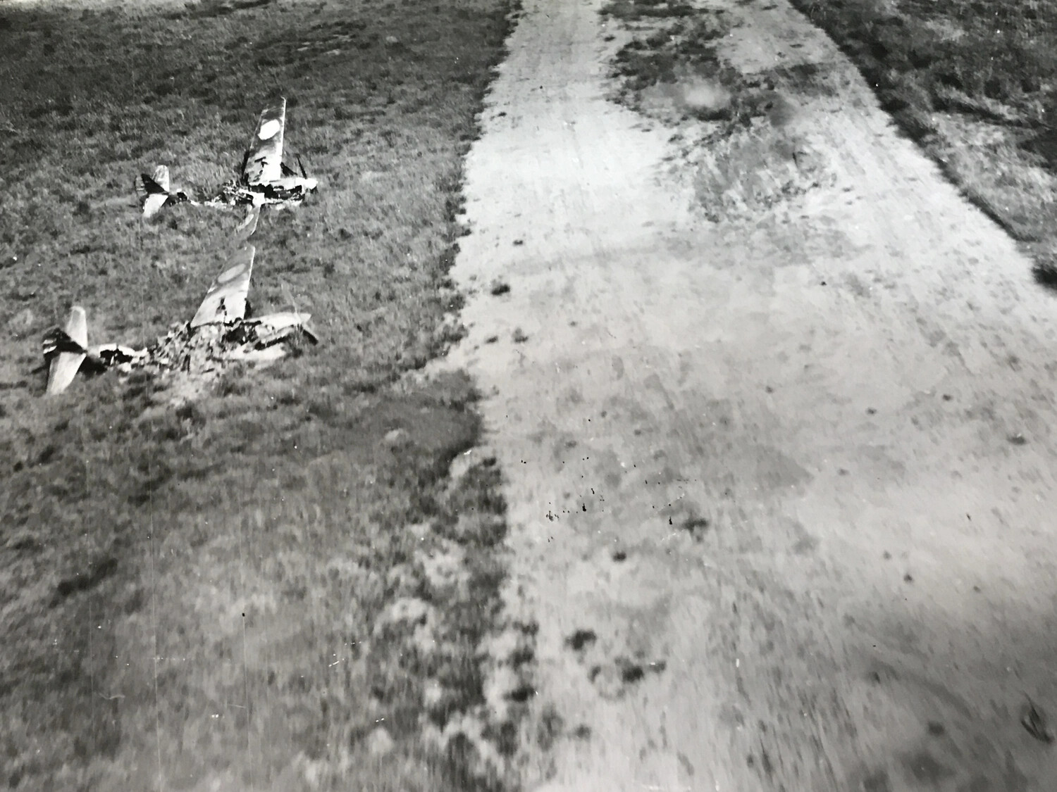 Two Destroyed Japanese Aircraft in Grass Beside Taxiway, Wom Point, Boiken, New Guinea