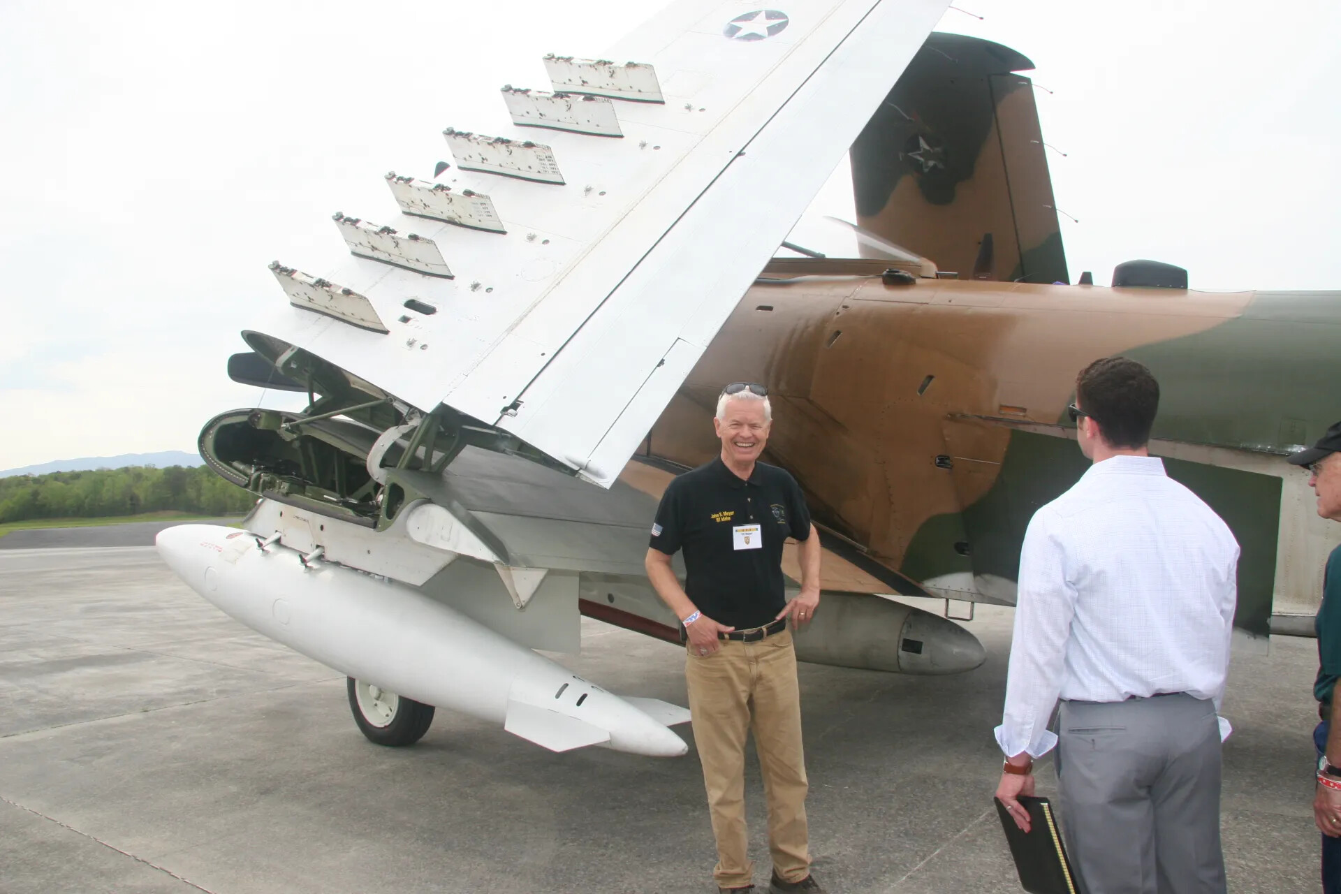 Douglas A-1 Skyraider with Wing Folded, Veteran Attendees at Operation Tailwind Reunion Event