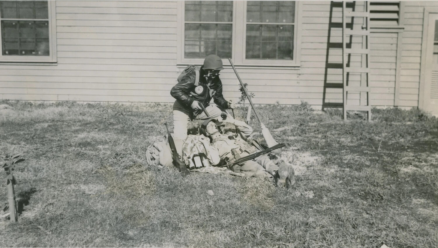Chemical Warfare Training Exercise with Gas Mask-Equipped Dummy, Military Training Post