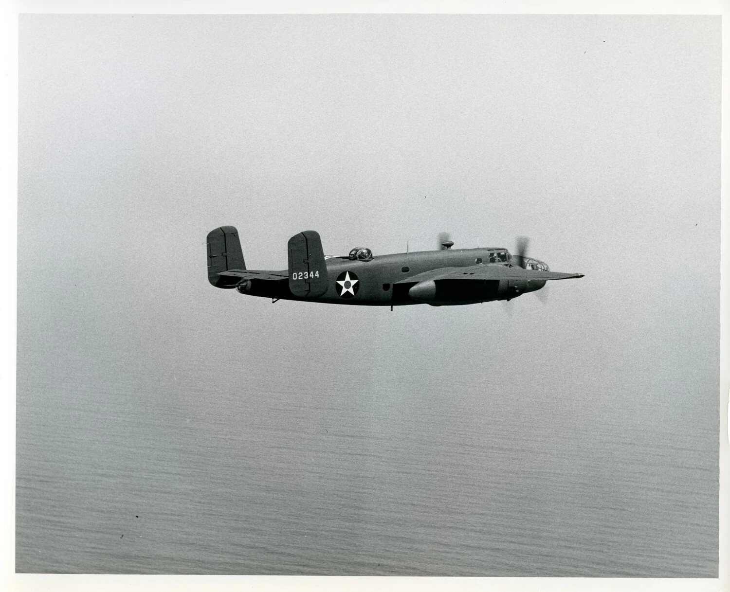 North American B-25 Mitchell Medium Bomber in Flight Over Water, Serial 02344 (c. 1942-1943)