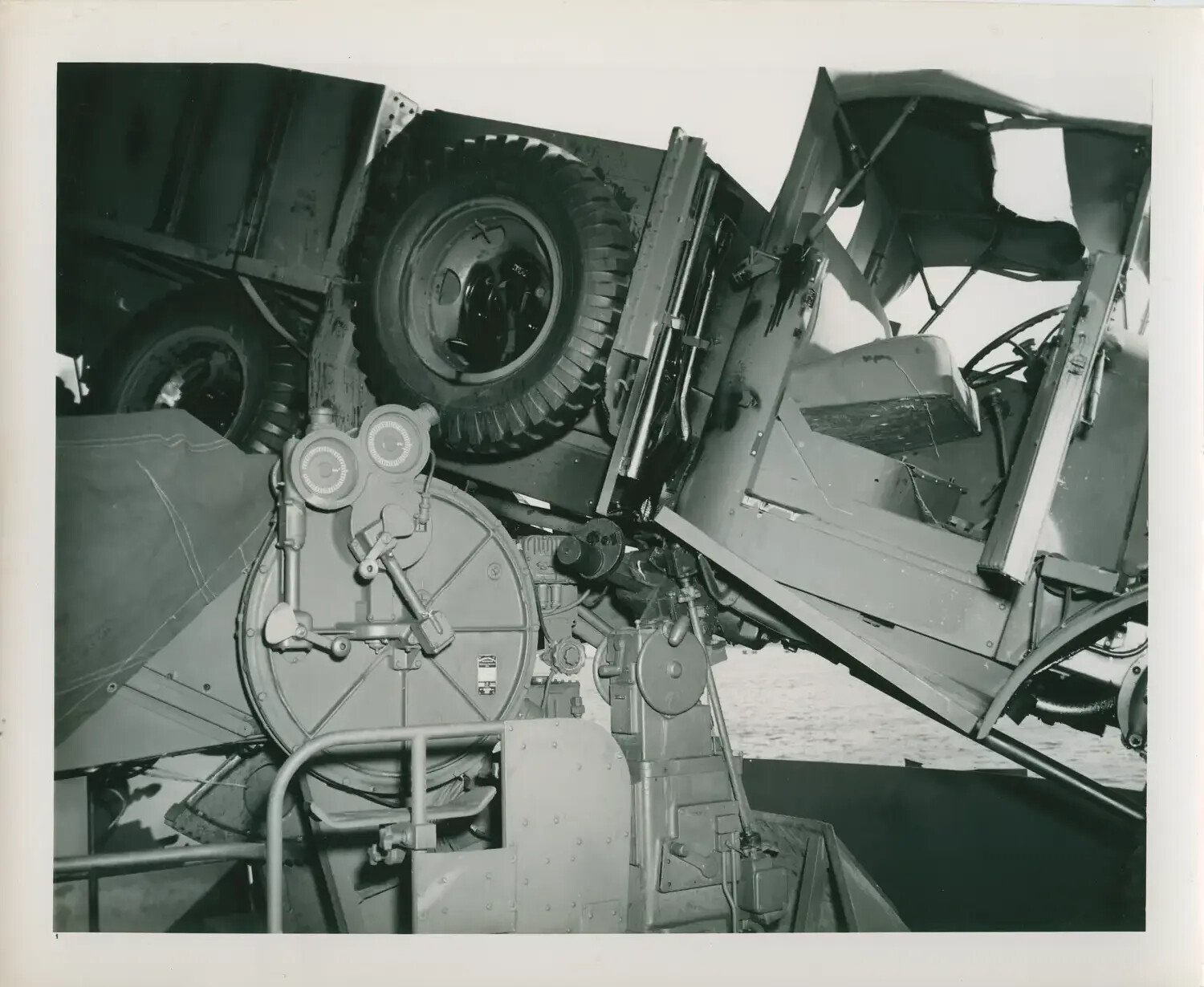 Storm or Combat Damage: Overturned Truck Atop Gun Director, USS Petrof Bay (CVE-80)
