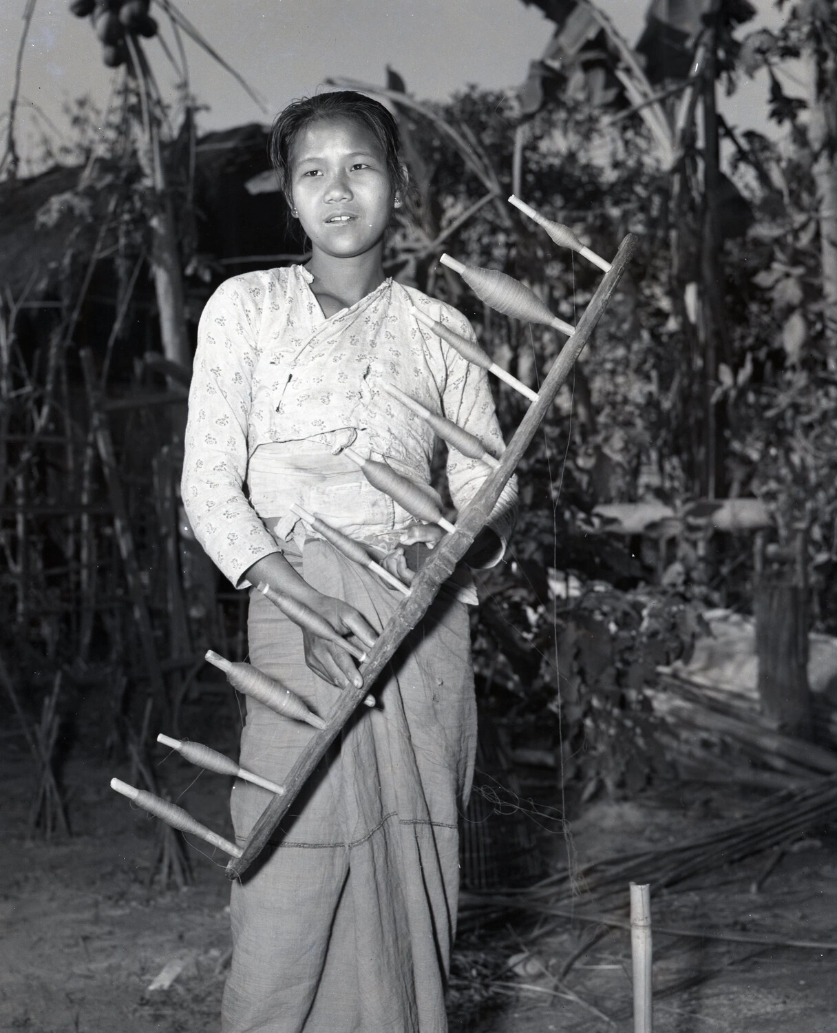 Burmese Woman with Traditional Thread-Winding Frame, China-Burma-India Theater, WWII