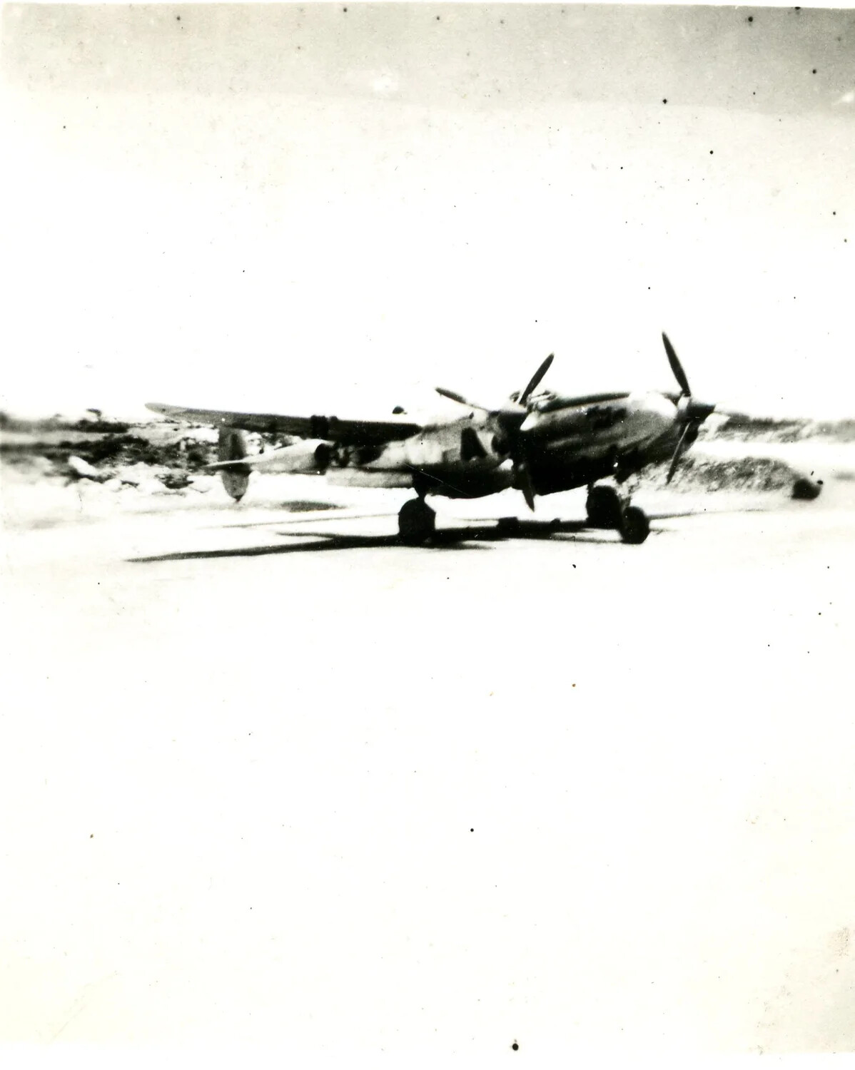 Lockheed P-38 Lightning Fighter on Unpaved Airstrip, Pacific Theater, WWII