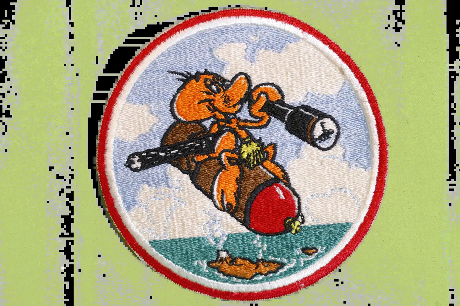 US Navy Squadron Patch: Cartoon Figure Riding Bomb, Korean War Era (Bancroft Collection)