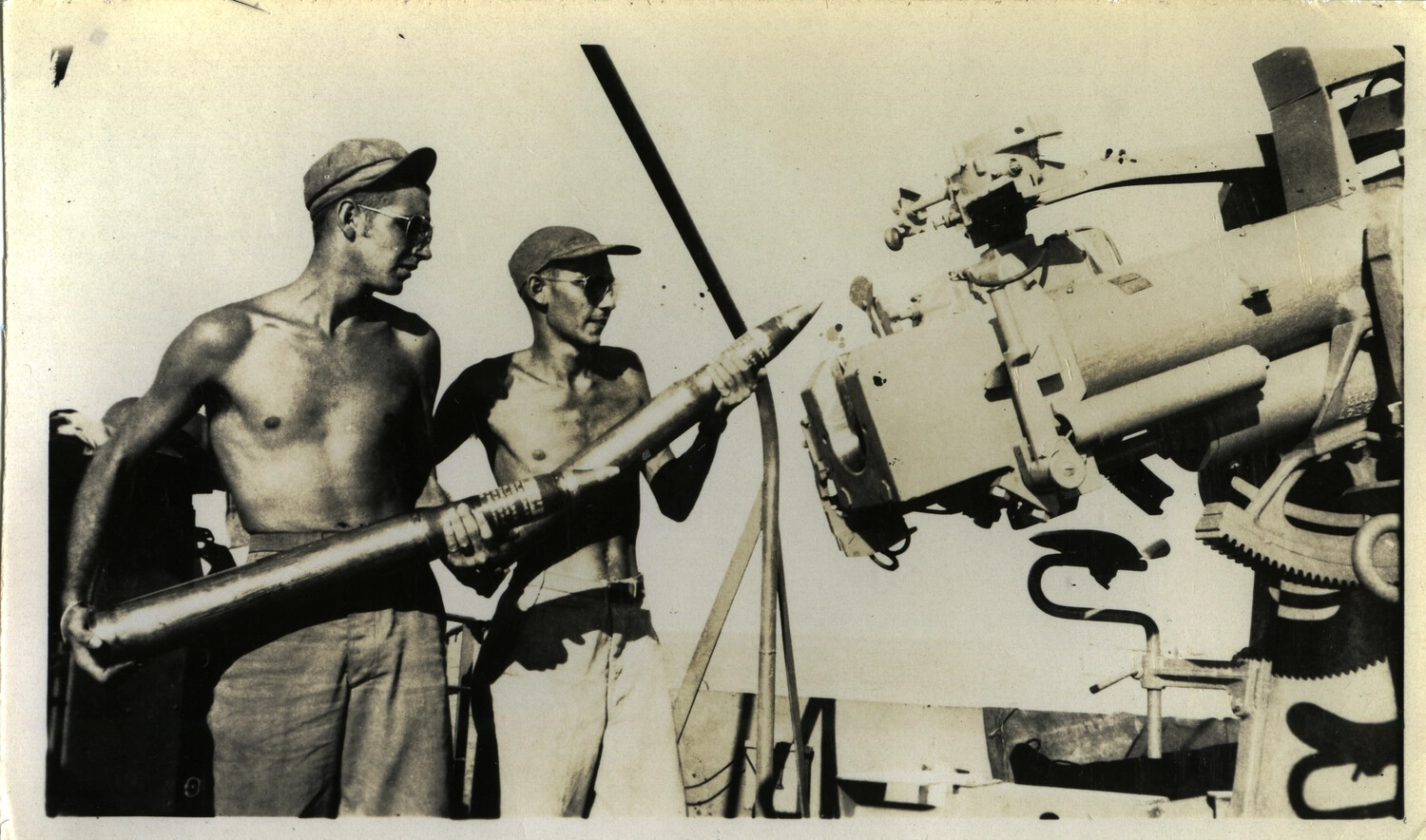 Sailors Loading a Deck Gun Aboard a U.S. Navy Vessel, Pacific Theater, World War II