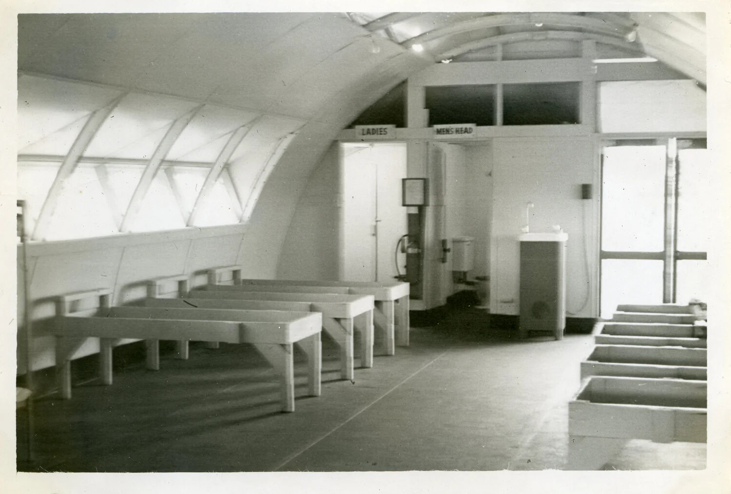 Interior of Quonset Hut Terminal Building with Restroom Signage - NATS VR-6, Agana, Guam