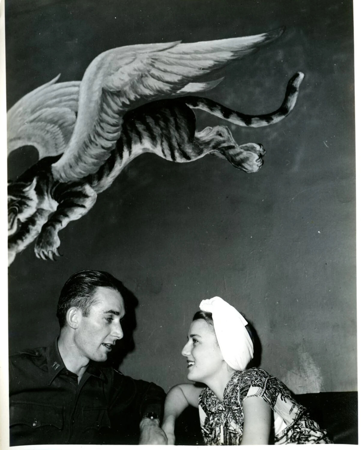 Officer and Companion Beneath Flying Tiger Mural, CBI Theater, WWII Era