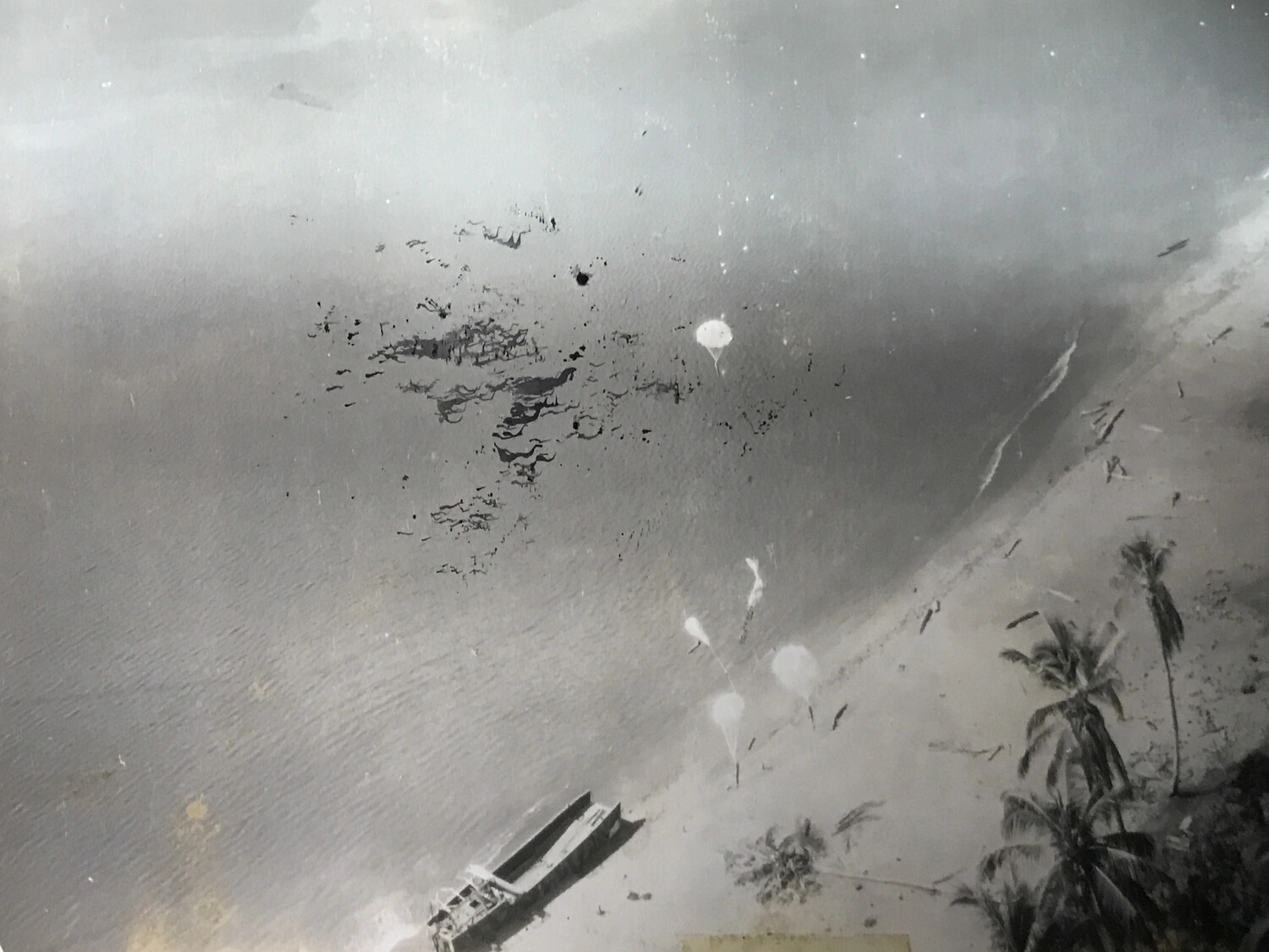 Parafrag Bombs Descending Over Beach, New Guinea Coast