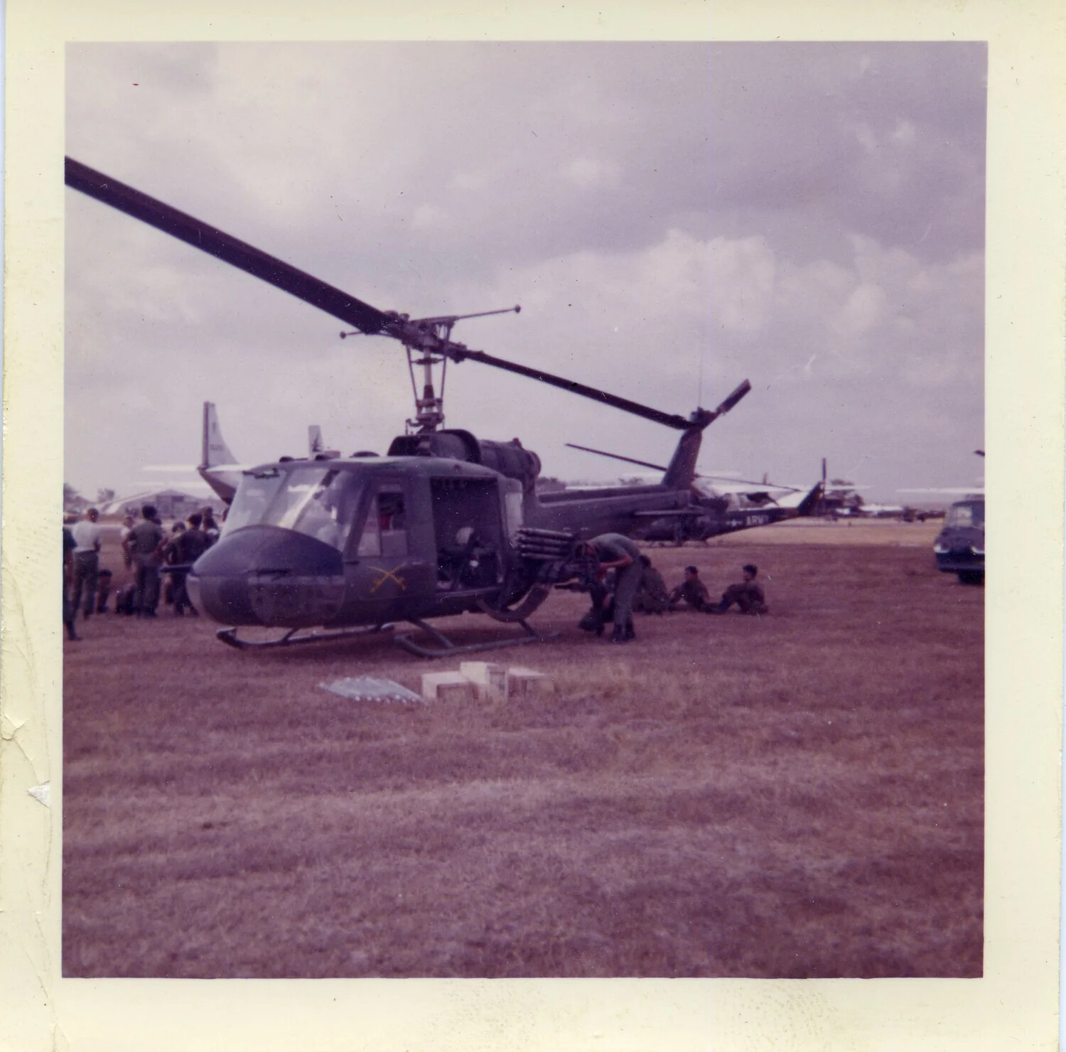 U.S. Army UH-1 Huey Gunship on Airfield with ARVN Liaison Aircraft, Vietnam, 1963