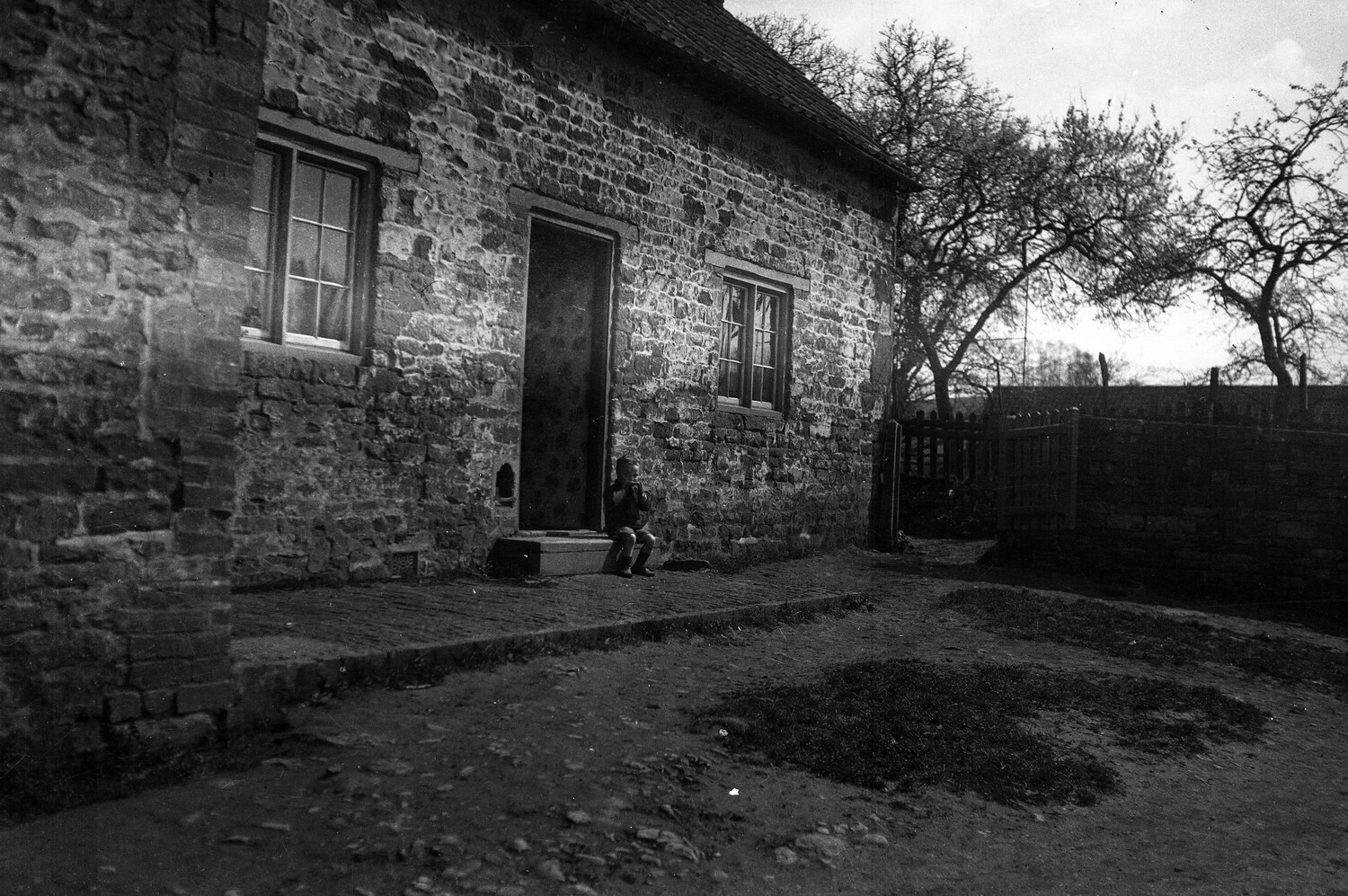 Rural Stone Farmhouse with Child on Doorstep, France, World War I Era