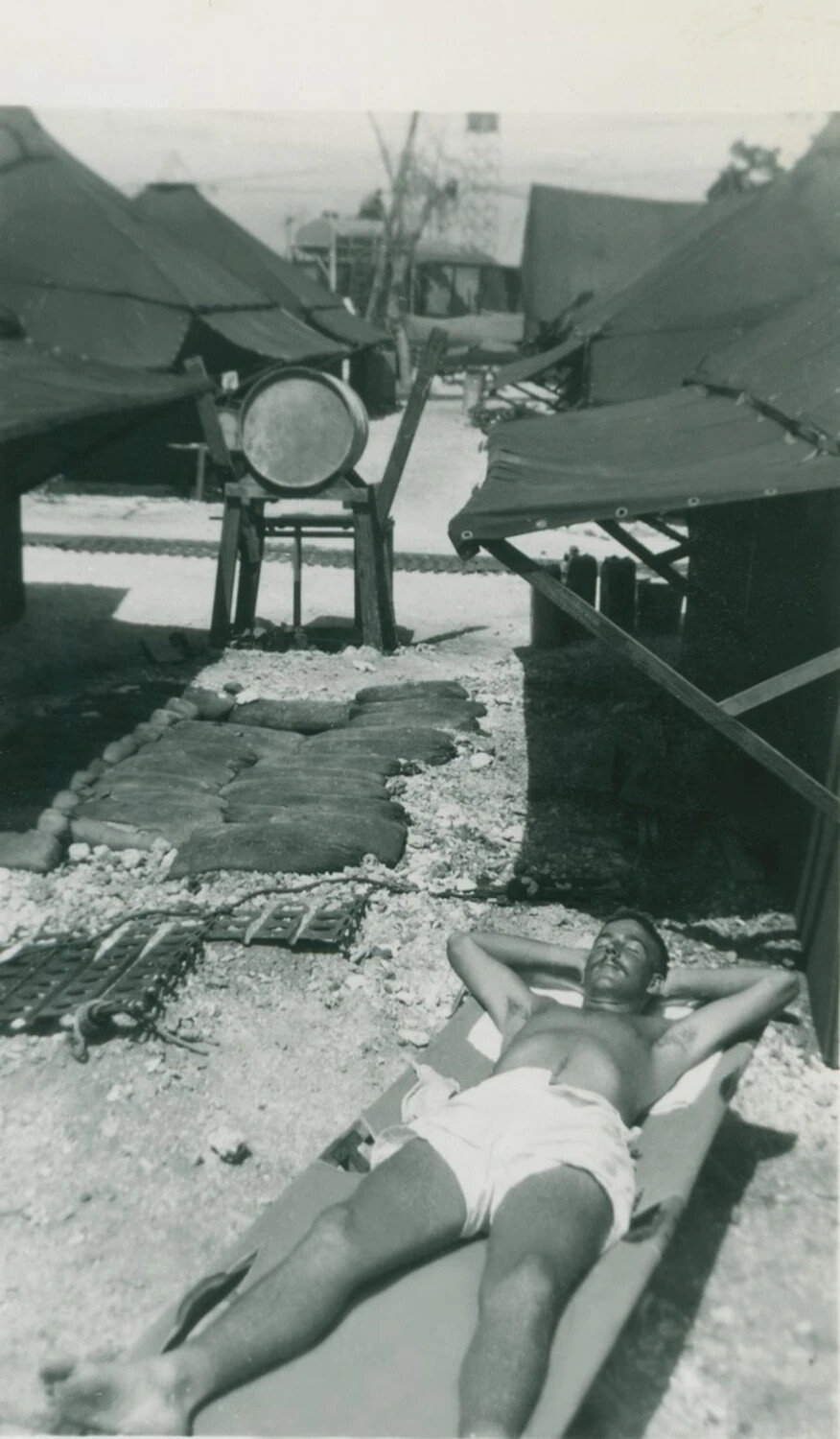 Serviceman Sunbathing at Pacific Island Tent Camp, WWII Era, McAleer Collection