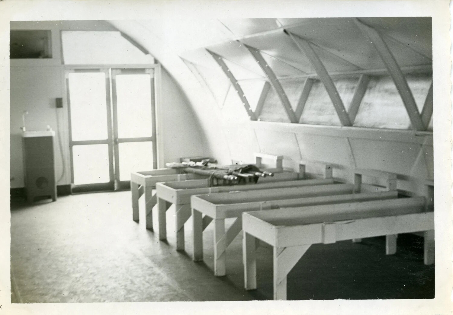 Interior of Quonset Hut with Parachute/Gear Packing Tables, Naval Air Station Agana, Guam (VR-6 Squadron Album)