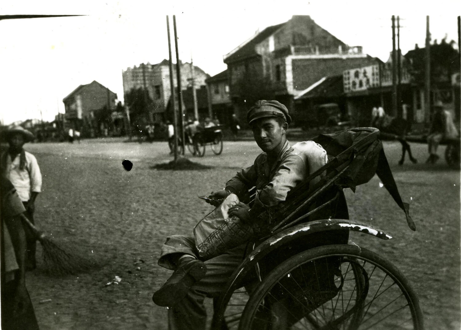 Soldier in Rickshaw on Town Street, Burma/CBI Theater Collection