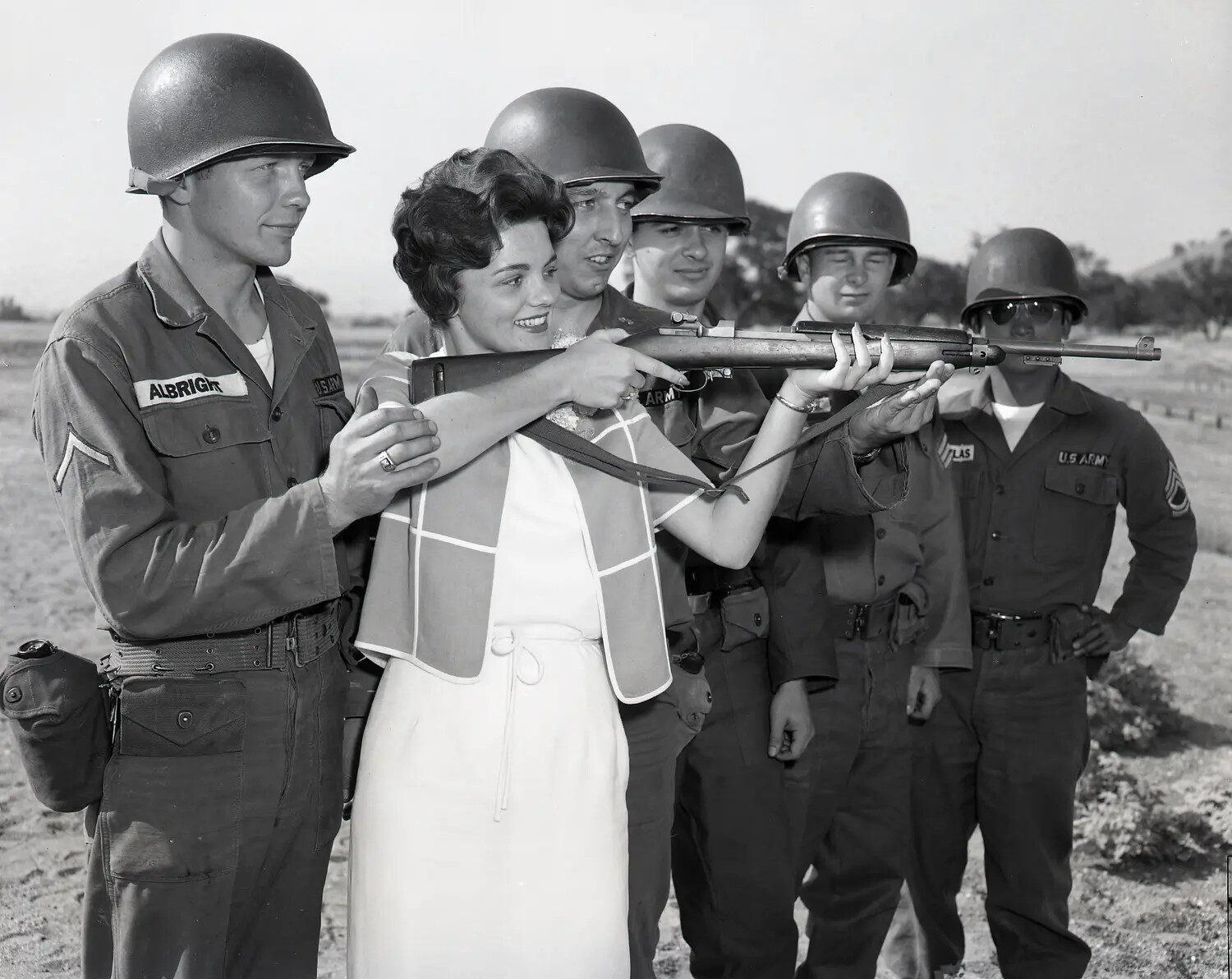 Civilian Visitor Instructed in Rifle Handling by California Army National Guard Soldiers, Summer Encampment, c. July 1960