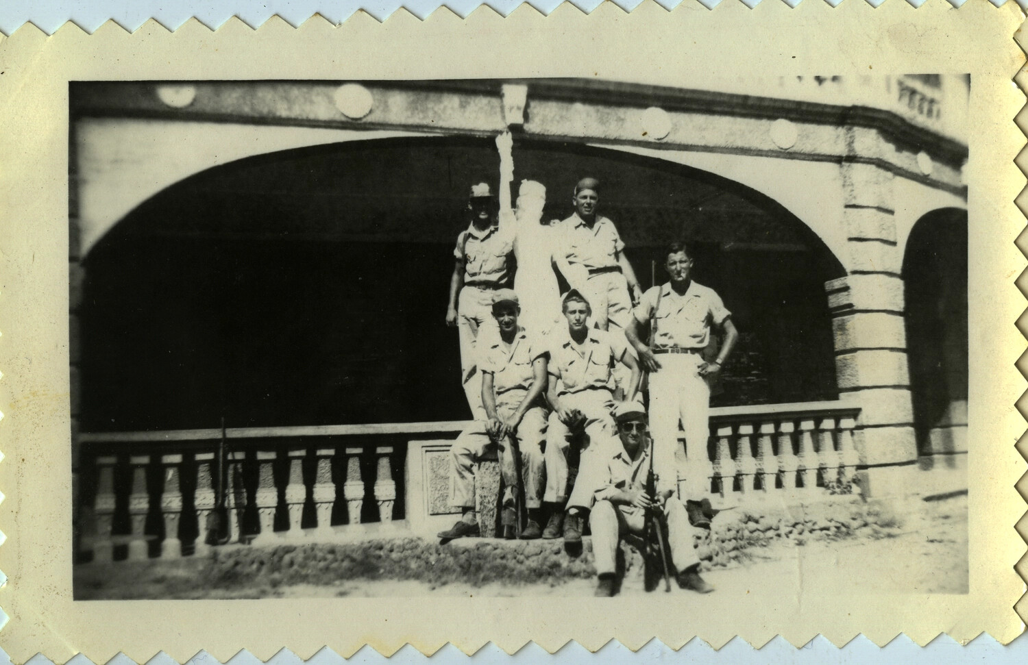 Group Portrait of American Servicemen at a Stone Bridge, Pacific Theater, World War II Era