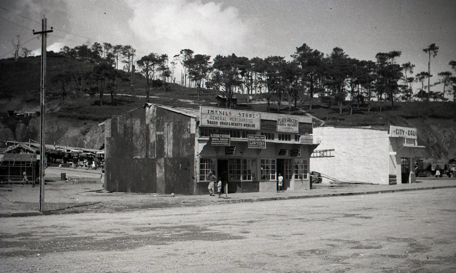 Rebuilt Commercial Storefronts on Luzon, Philippines -- 'Imanil's Store' and 'City Drug,' Post-War Baguio Area