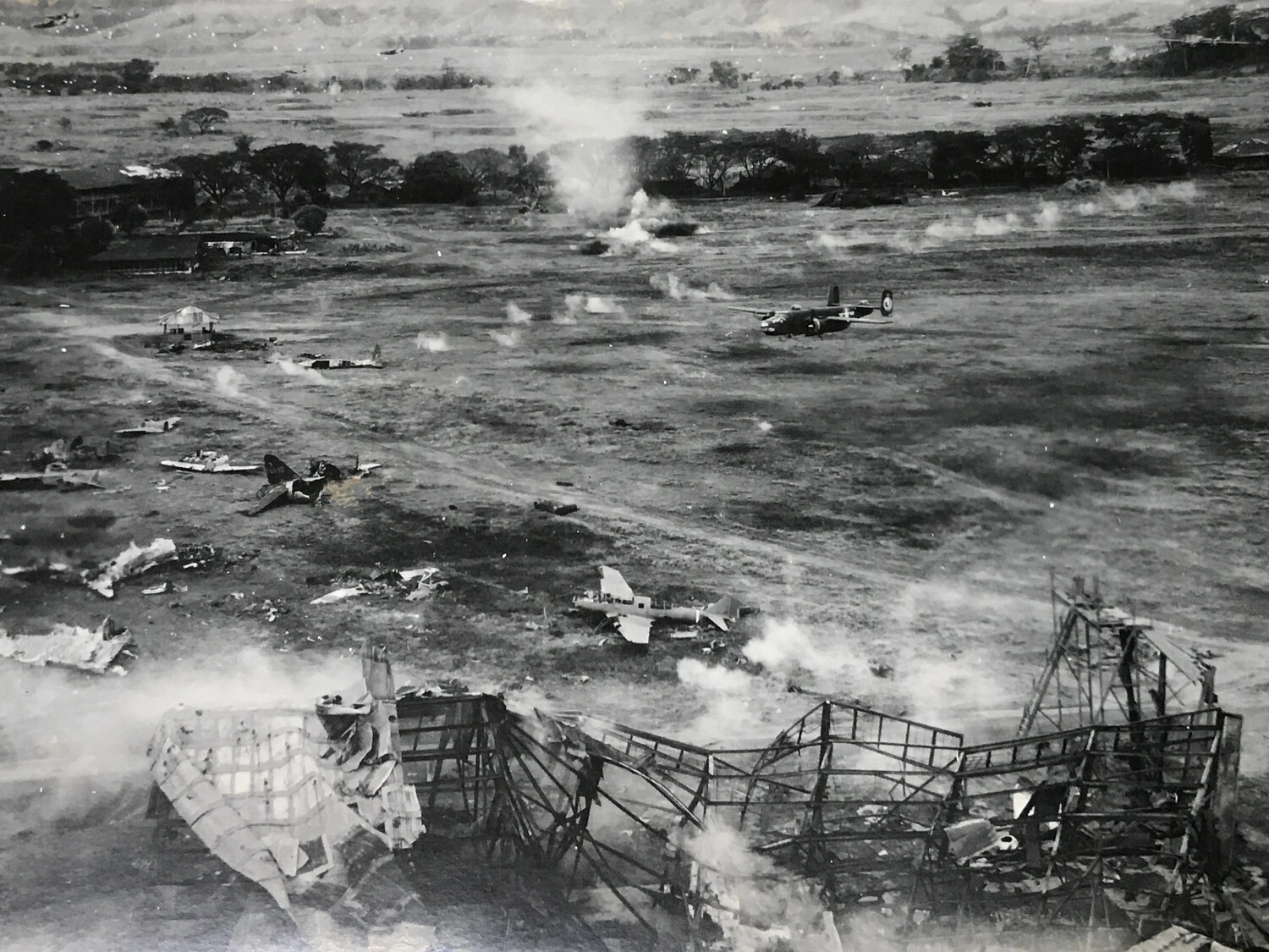 B-25 Mitchell Strafing Run Over Wrecked Japanese Airfield, Pacific Theater