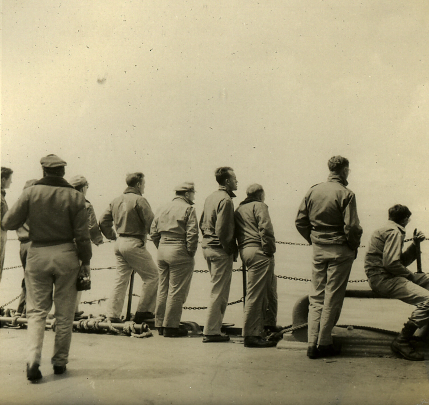 Servicemen at the Rail Watching the Sea, Transit Voyage to Japan (Postwar Era Album)