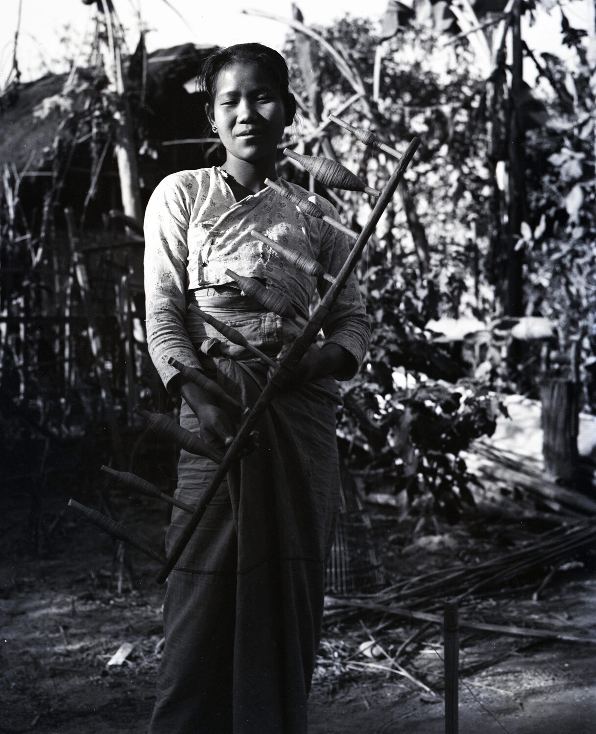 Portrait of a Local Woman with Bamboo Weaving Bobbins, China-Burma-India Theater