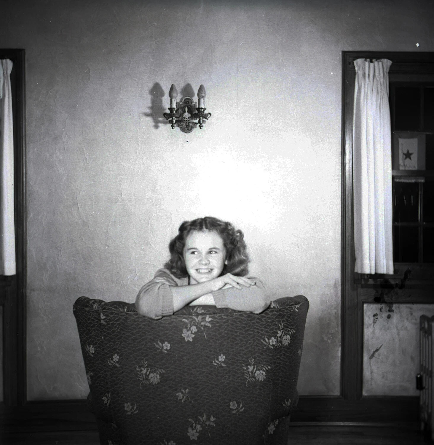 Portrait of a Young Woman at Home, with WWII Service Flag Visible in Window