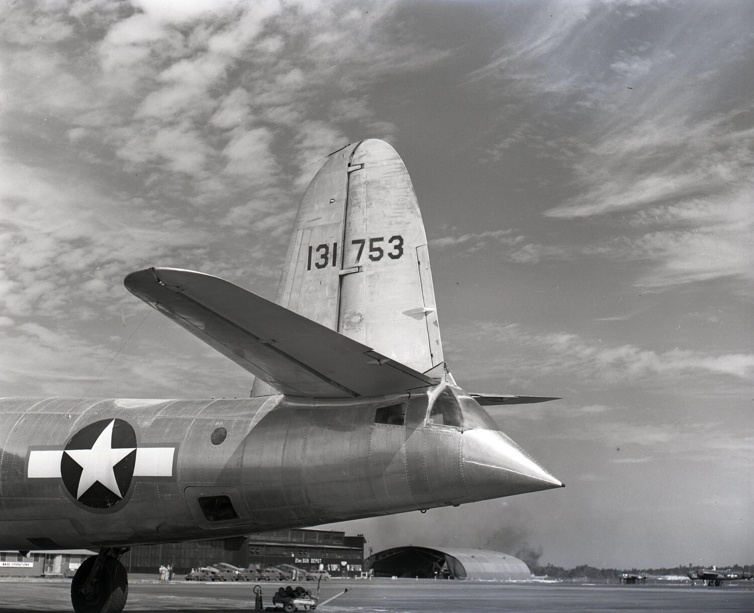 USAAF Transport Aircraft Tail Section, Serial 131753, with '21st Sub Depot' Hangar in Background