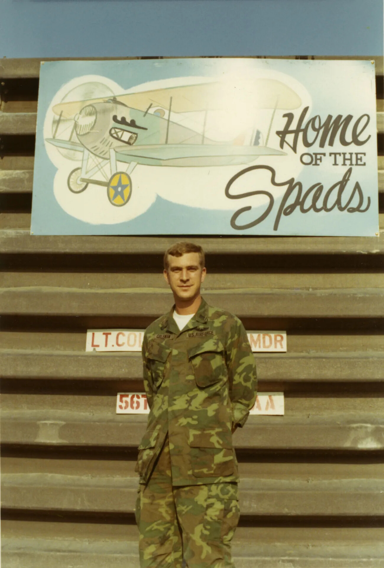 USAF Airman Coleman Beneath "Home of the Spads" Squadron Sign, Vietnam War Era