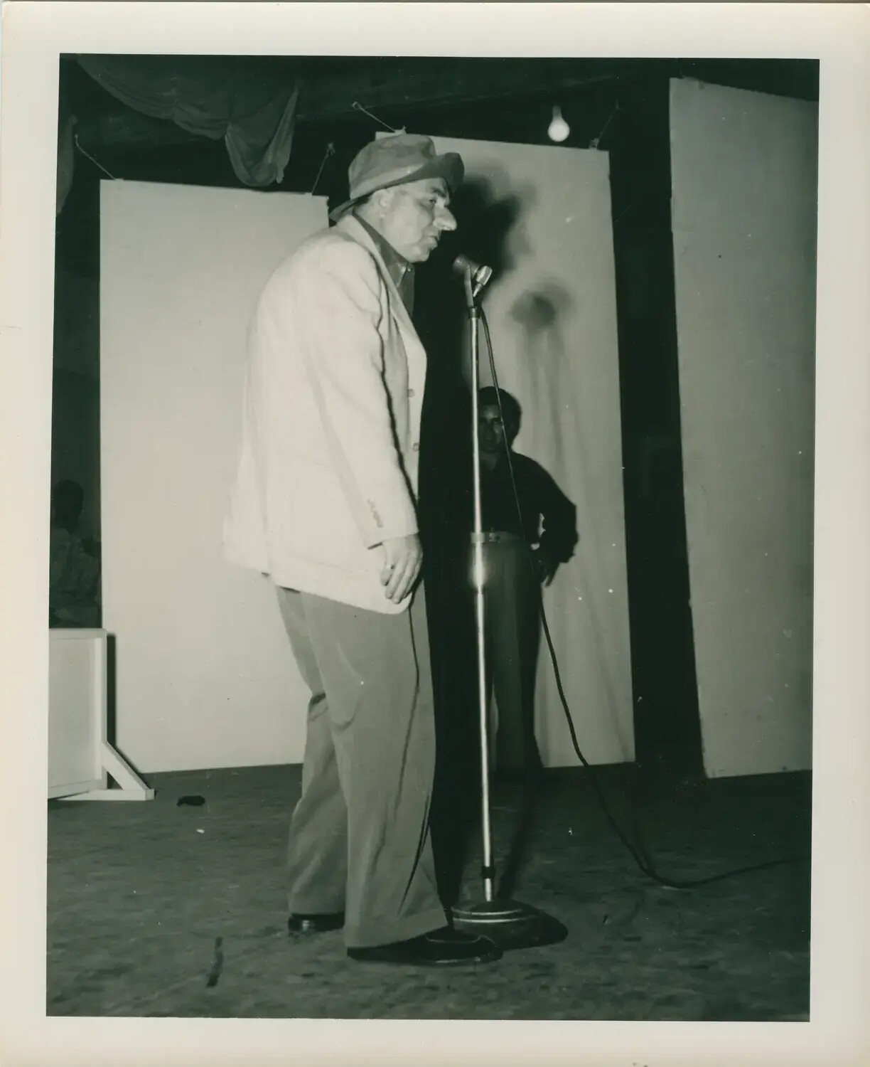 Shipboard Entertainer at Microphone, USS Petrof Bay (CVE-80), World War II