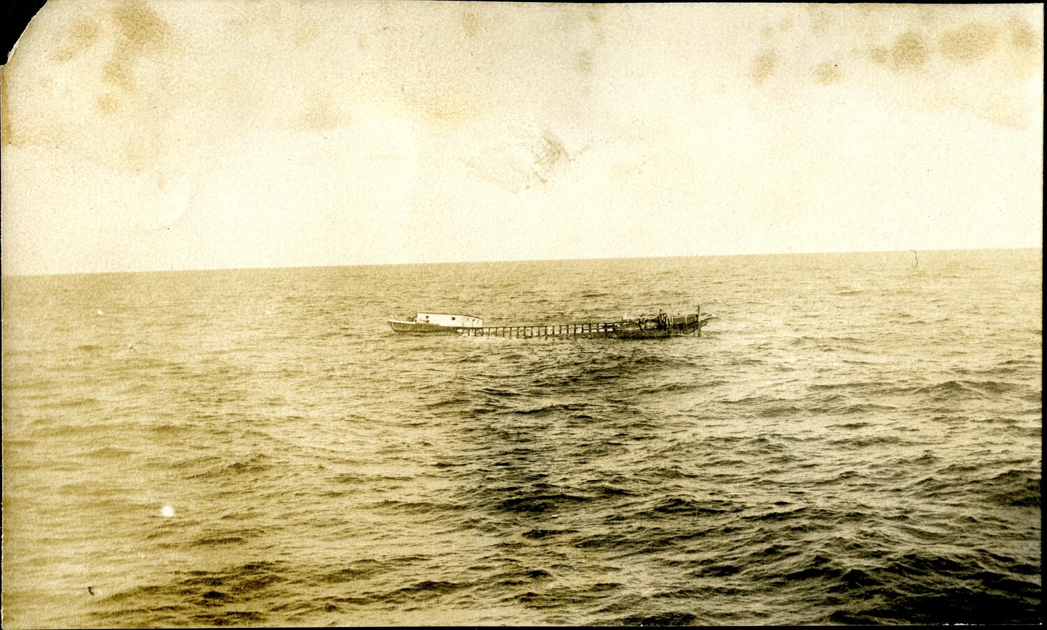 Small Vessel or Hulk Sighted at Sea, USS Columbia (CL-56) Photo Album, WWII Pacific Theater