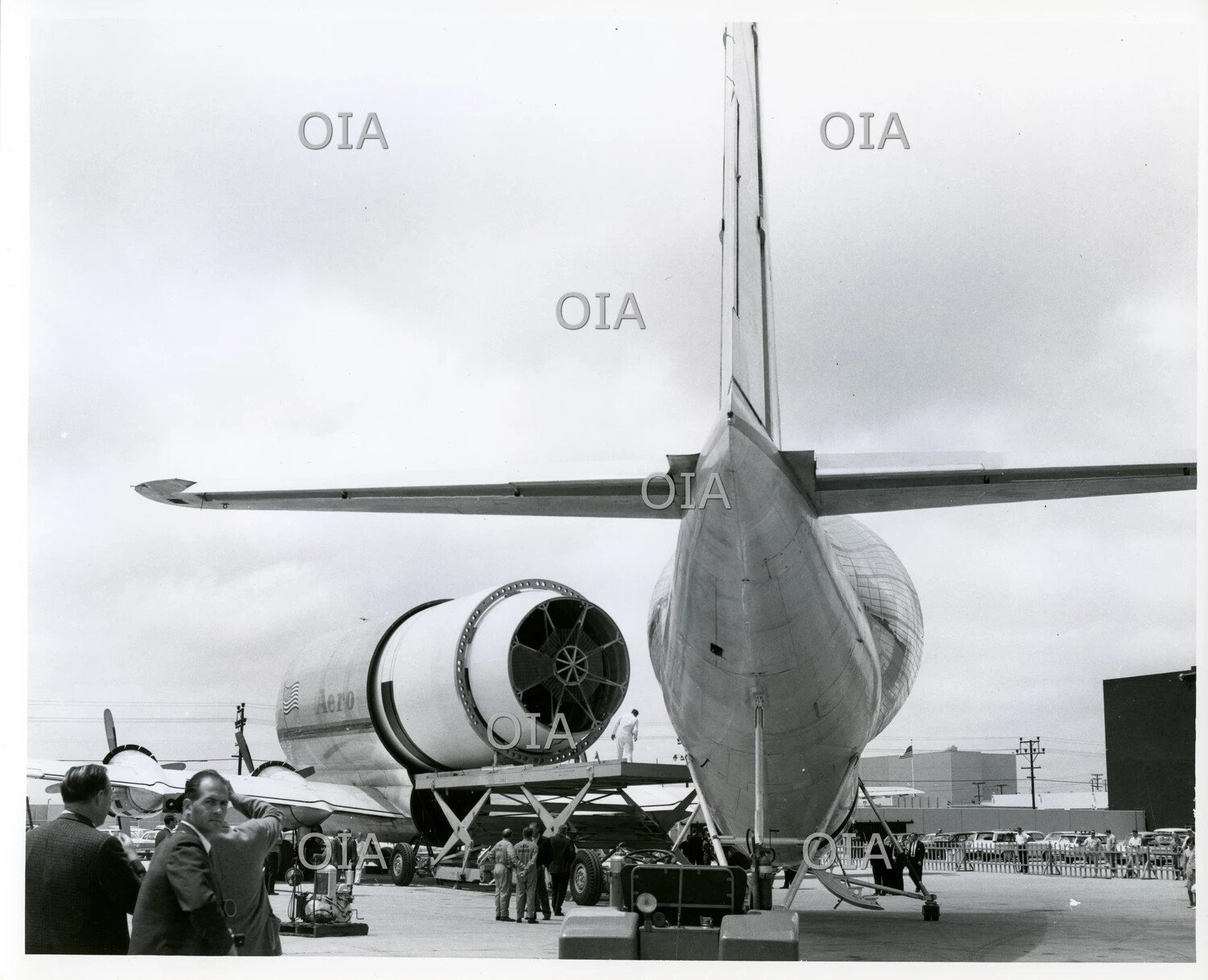 Rear View of Aero Spacelines Guppy Aircraft with Swing-Tail Fully Open, Cargo Loading Trailer in Position
