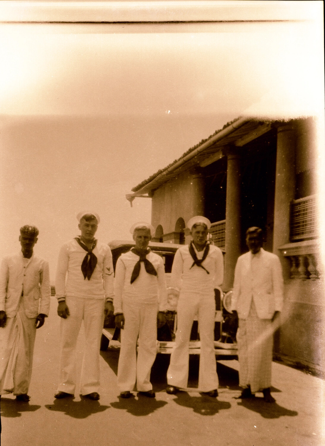 U.S. Navy Sailors and Local Men Beside Automobile, Colonial Port City, 1930s Asiatic Station
