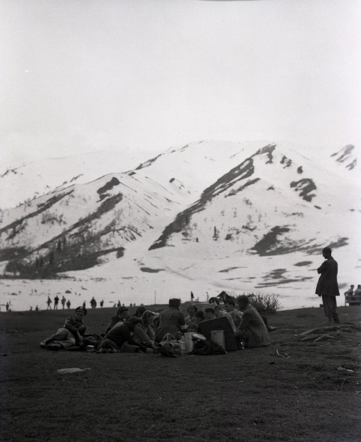 Servicemen and Companions Picnicking Below Snow-Capped Peaks, Kashmir