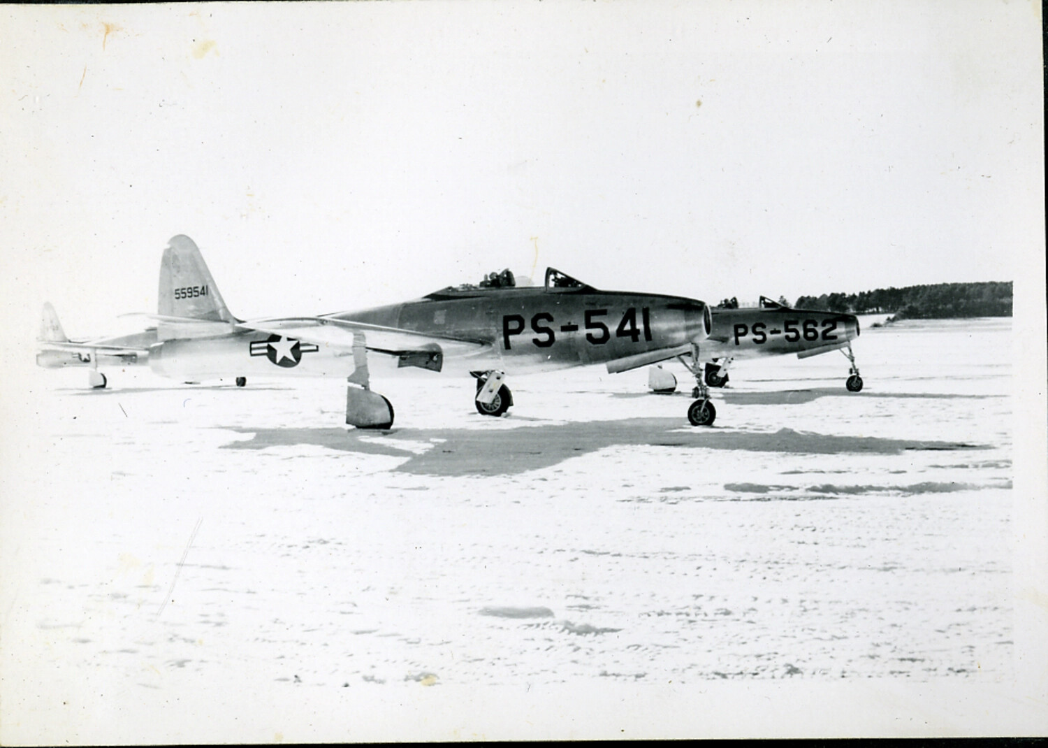 Republic F-84 Thunderjets 'PS-541' and 'PS-562' on Snow-Covered Airfield, Japan — Postwar/Korean War Era