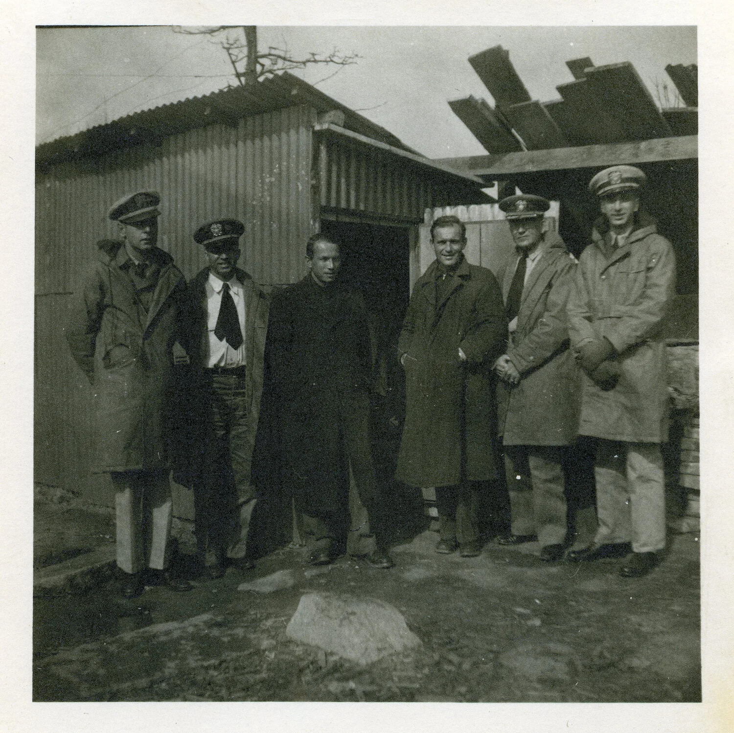 U.S. Navy Officers and Civilian at Improvised Corrugated-Metal Structure, Occupied Hiroshima, Japan