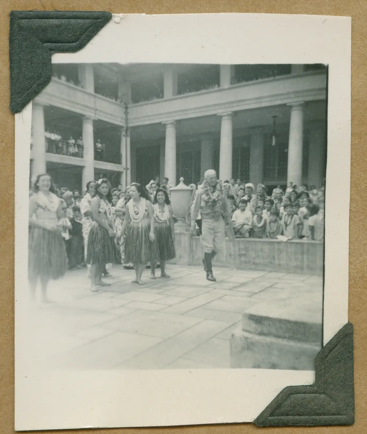 Senior Officer Greeted by Hula Dancers in Courtyard, Honolulu, Hawaii, World War II Era