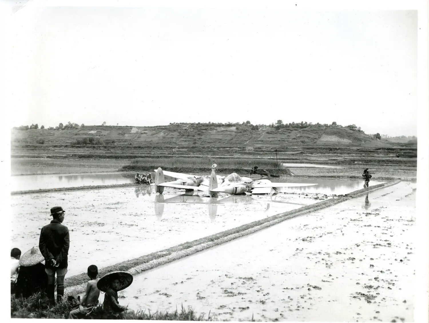 Crash-Landed P-38 Lightning in Flooded Rice Paddy, China-Burma Theater, WWII
