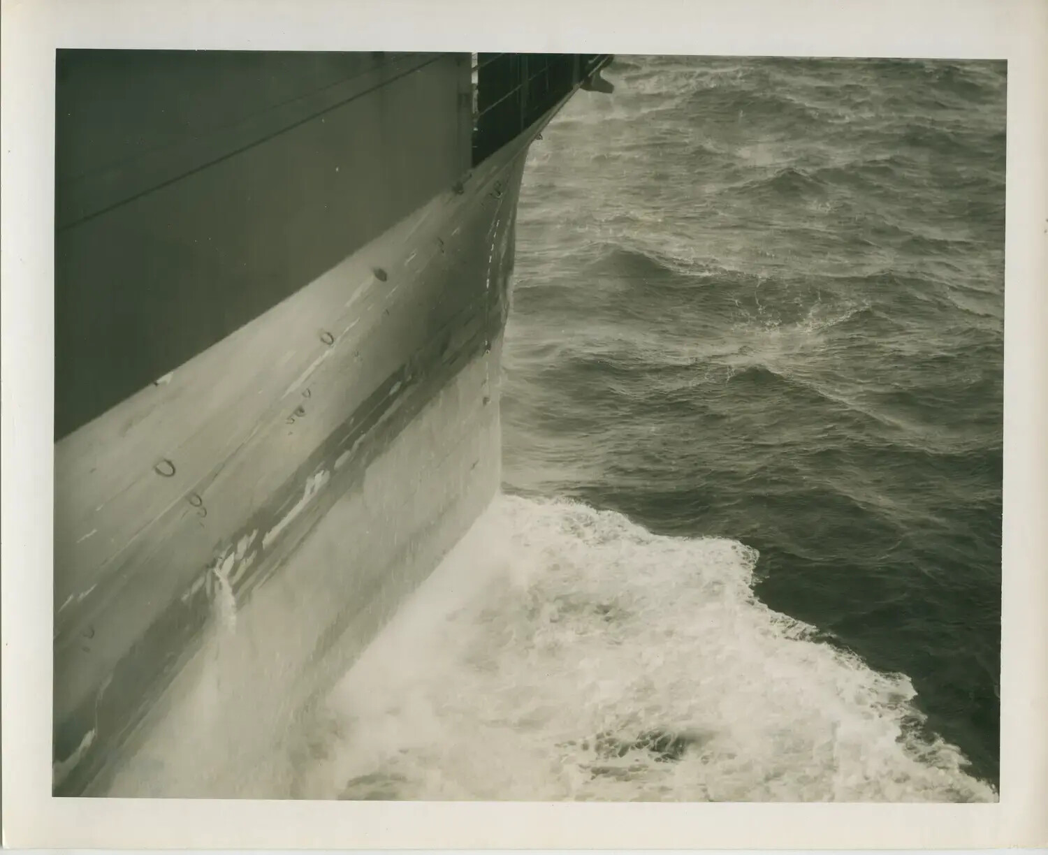 Bow Wake and Hull of USS Petrof Bay (CVE-80) in Heavy Seas, World War II