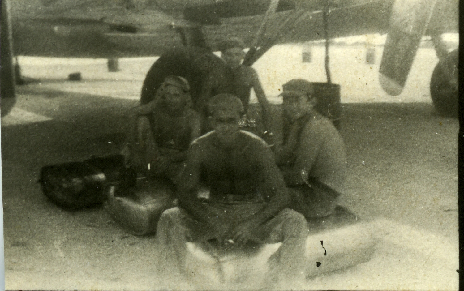 American Airmen Resting Beneath Aircraft Wing, Pacific Theater, World War II