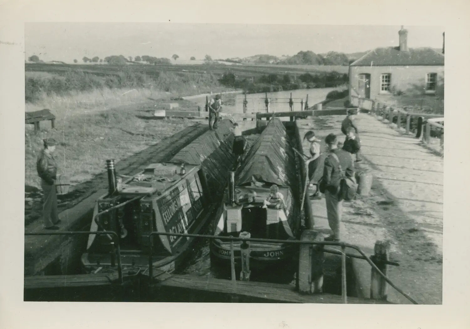 American Airman Observing Narrowboats at an English Canal Lock, 1943