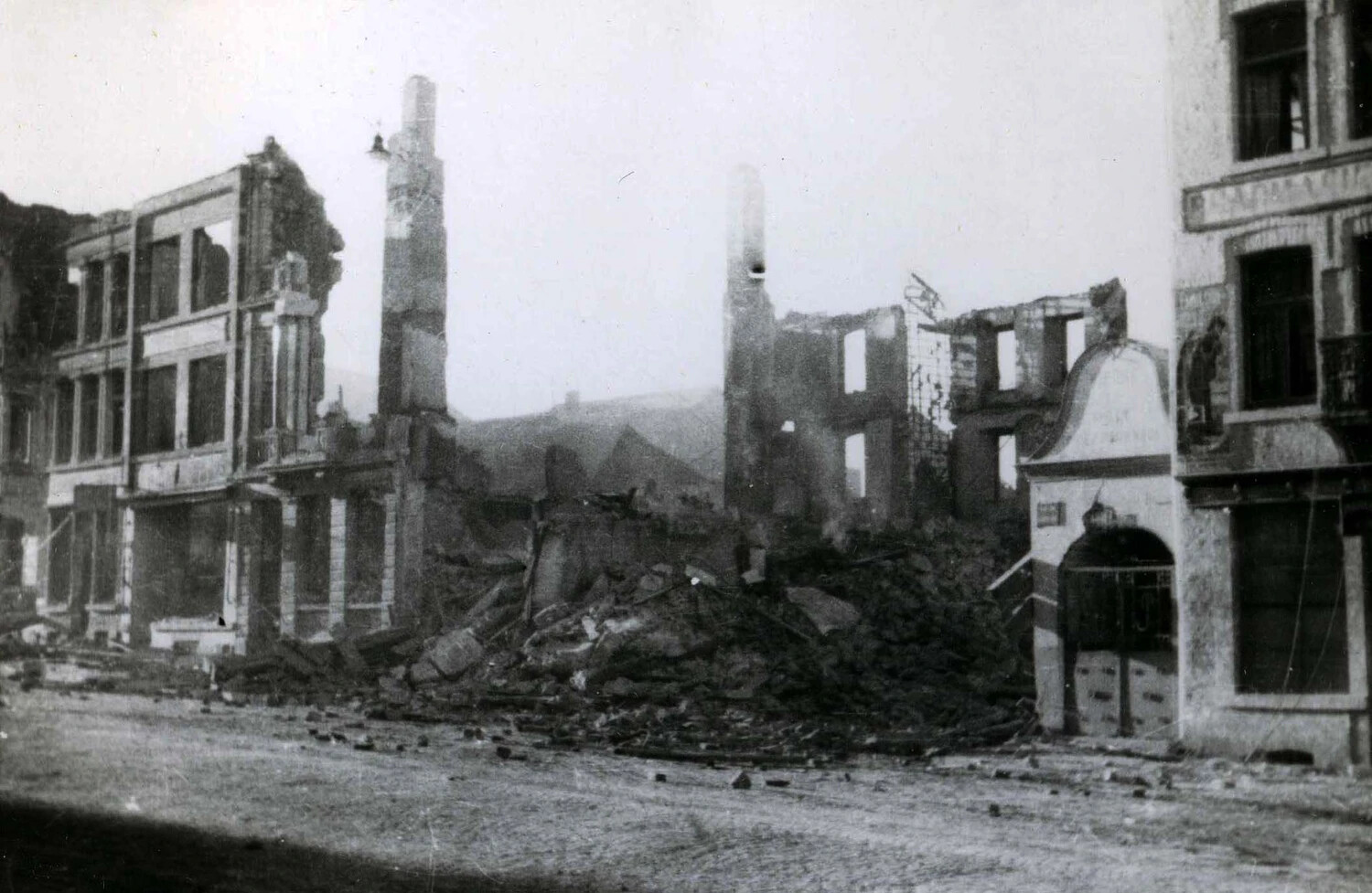 Devastated City Street with Standing Chimneys and Rubble, WWII European Theater
