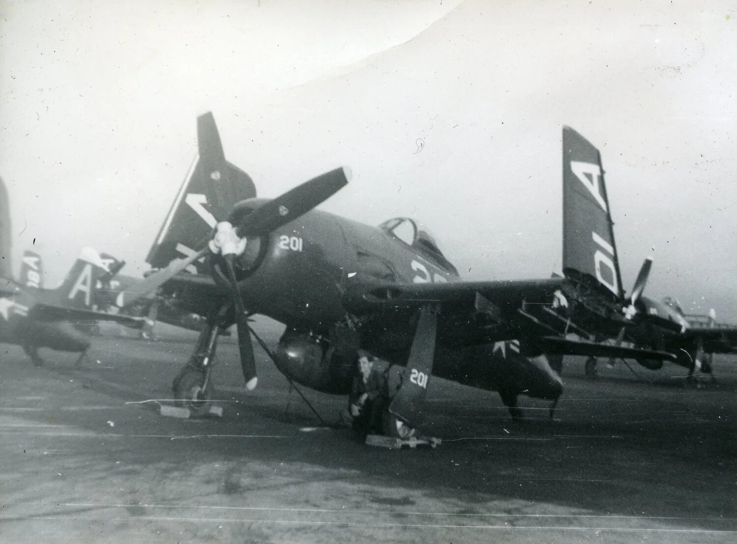 F4U Corsair Fighters of Marine Fighting Squadron VMF-214 on an Airfield Apron, 1945