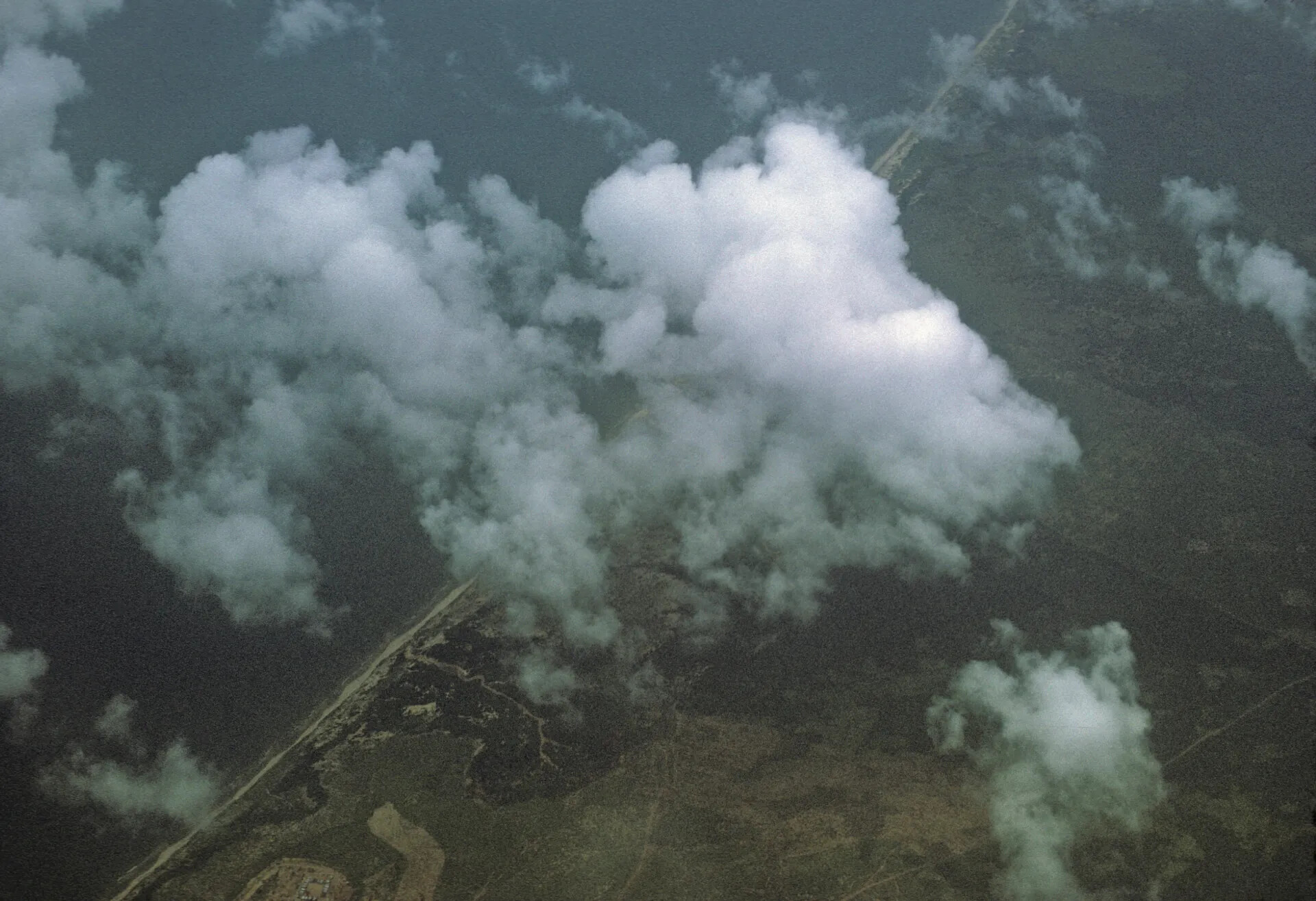 Aerial View of Jungle Terrain and Cumulus Clouds, South Vietnam, 1969